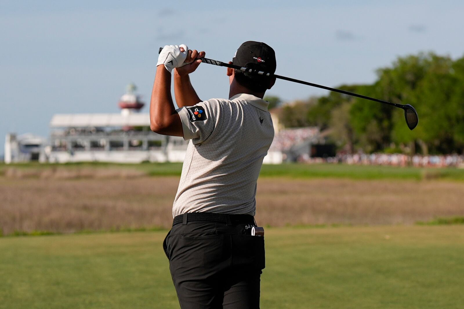 Si Woo Kim hits from the 18th tee during the third round of the RBC Heritage golf tournament, Saturday, April 19, 2025, in Hilton Head Island, S.C. (AP Photo/Mike Stewart)