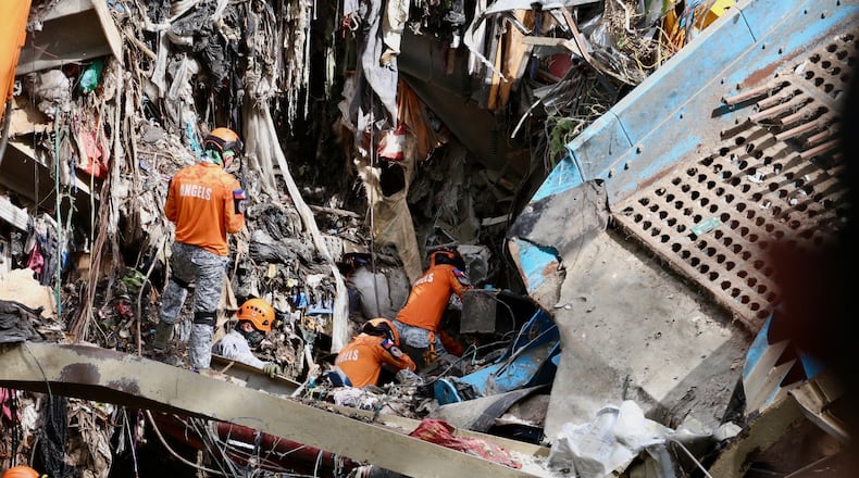 Rescuers continue operations on a collapsed waste segregation facility in Binaliw, Cebu city, central Philippines on Saturday, Jan. 10, 2026. (AP Photo/Jacqueline Hernandez)