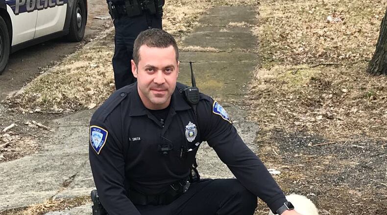 Officer Dan Smith with Wilbur the runaway pig