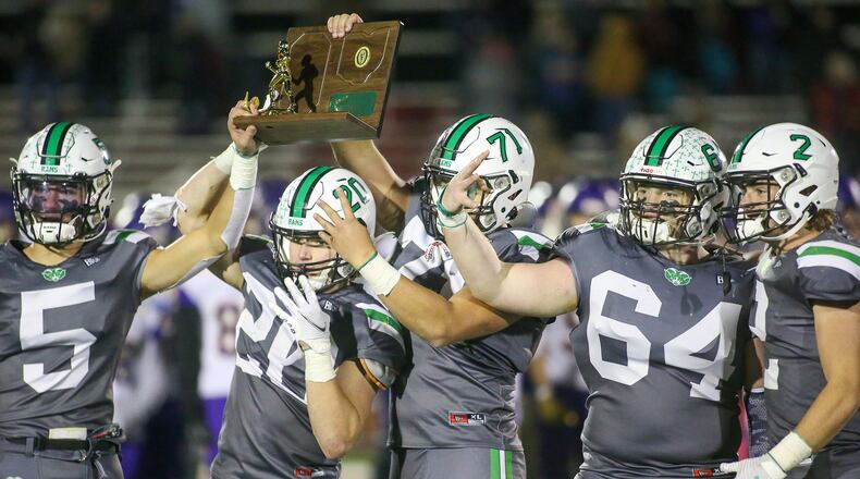 The captains of the Badin High School football team hold the trophy after beating Bellbrook 21-9 in the Division III, Region 12 final on Friday night at Trotwood Madison High School. CONTRIBUTED PHOTO BY MICHAEL COOPER