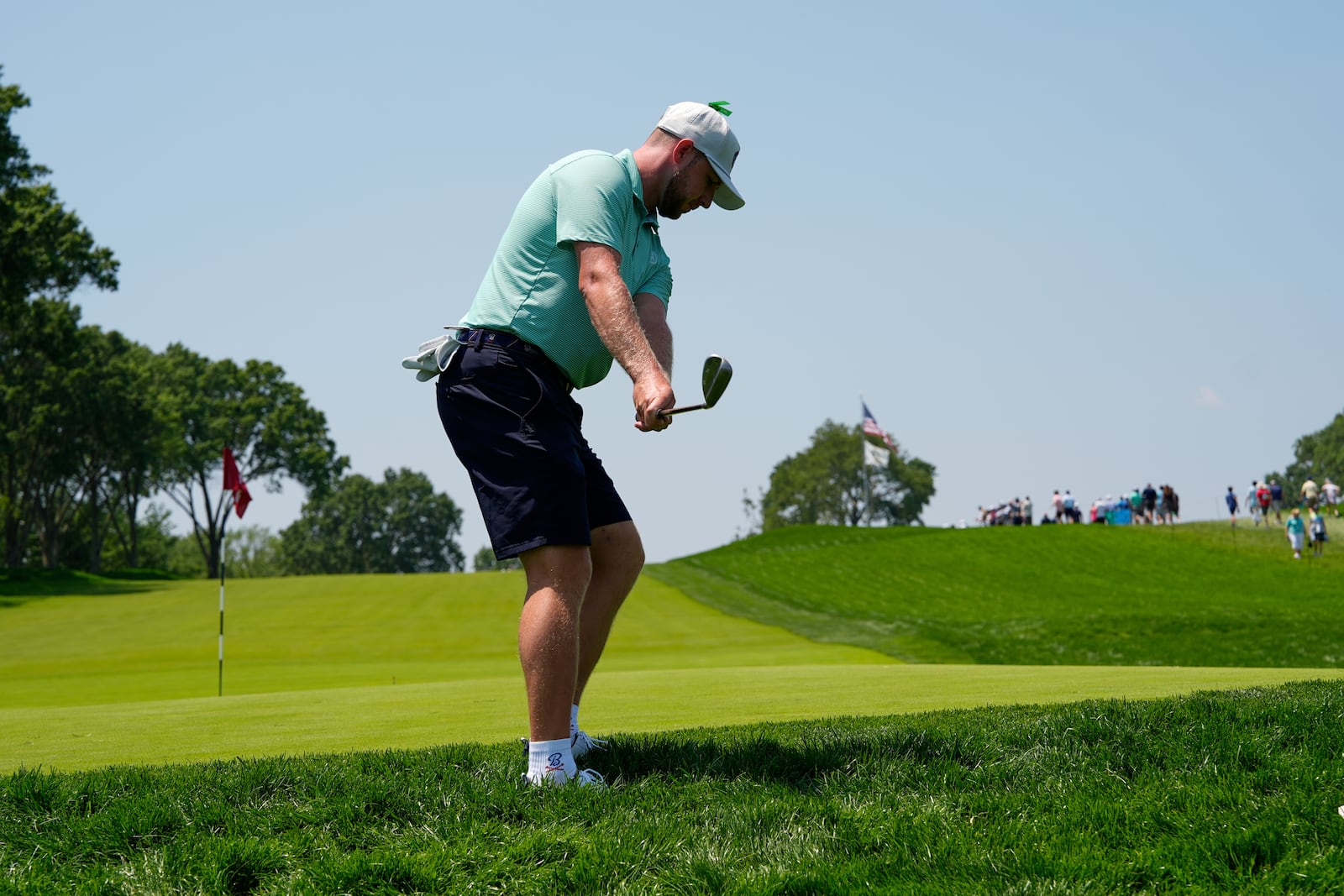 Alistair Docherty chips onto the first green during a practice round ahead of the U.S. Open golf tournament at Oakmont Country Club Wednesday, June 11, 2025, in Oakmont, Pa. (AP Photo/Charlie Riedel)
