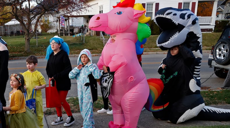 FILE PHOTO: The sidewalks in Springfield were filled with ghouls and goblins with the occasional super hero and princess thrown in for good measure Saturday night, Oct. 29, 2022 during this year's Trick or Treat in Clark County. Kids of all ages went door to door to houses, some with elaborate decorations, filling their bags with sweet treats. BILL LACKEY/STAFF