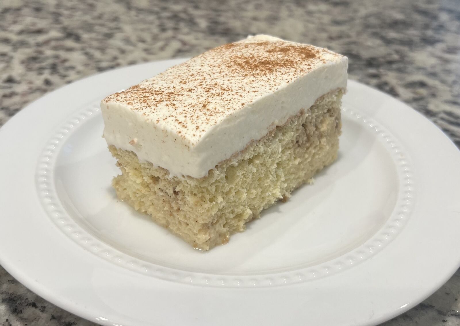 Nando’s Peruvian Crafted Kitchen will host pickup events every other Saturday at Busy Bee Commercial Kitchen, 210 S. Main St. in Springboro. Pictured is the tres leches, a vanilla sponge cake soaked in a three milk mixture and topped with whipped cream and powder cinnamon (CONTRIBUTED PHOTO).