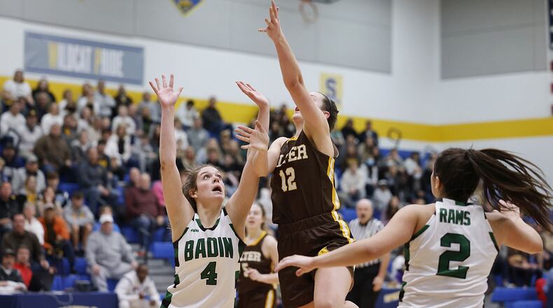 Archbishop Alter's Karlie Romer (12) puts up a shot defended by Badin's Lauren Grawe during their girls Division II regional final basketball game Friday, March 4, 2022 at Springfield High School in Springfield. Alter won 45-35. NICK GRAHAM/STAFF
