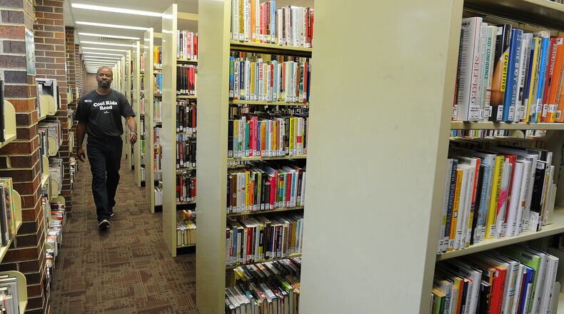 Shelving height and space at the Troy-Miami County Public Library can to challenging to people's mobility issues. MARSHALL GORBY\STAFF