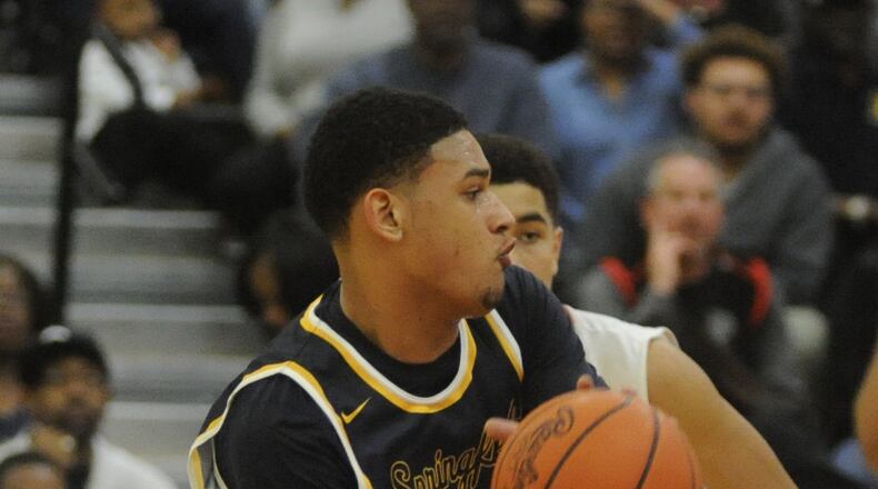 Springfield’s Leonard Taylor looks for an opening during a 56-54 win at Wayne last Friday that clinched an outright GWOC National East title. MARC PENDLETON / STAFF