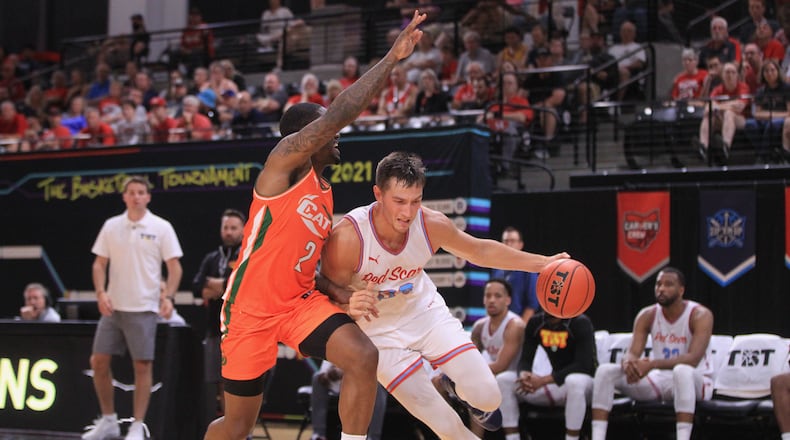 Ryan Mikesell, of Red Scare, dribbles against Category 5 in the second round of The Basketball Tournament on Sunday, July 25, 2021, at the Covelli Center in Columbus. David Jablonski/Staff