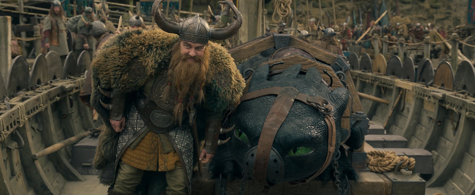 This image released by Universal Pictures shows Gerard Butler, left, and Night Fury dragon, Toothless in a scene from "How to Train Your Dragon.", (Universal Pictures via AP)