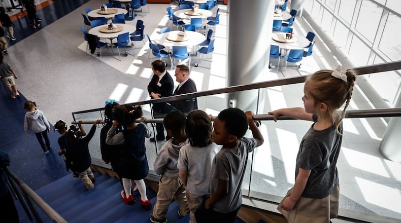 Students at the Greater Dayton School held down to the gymnasium for the grand opening and ribbon cutting to open the school. JIM NOELKER/STAFF
