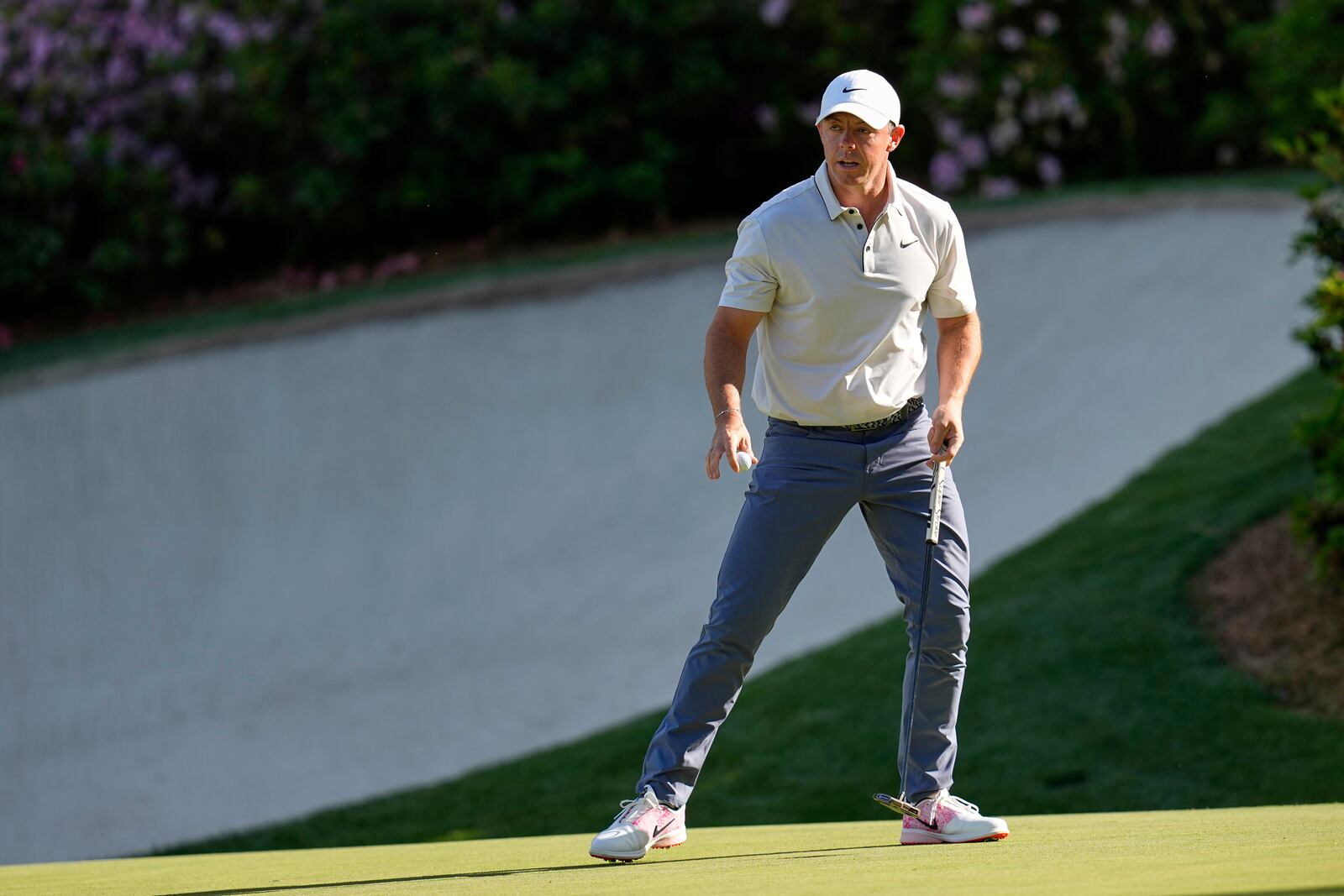 Rory McIlroy, of Northern Ireland, waves after making a putt on the 13th hole during the third round at the Masters golf tournament, Saturday, April 12, 2025, in Augusta, Ga. (AP Photo/David J. Phillip)