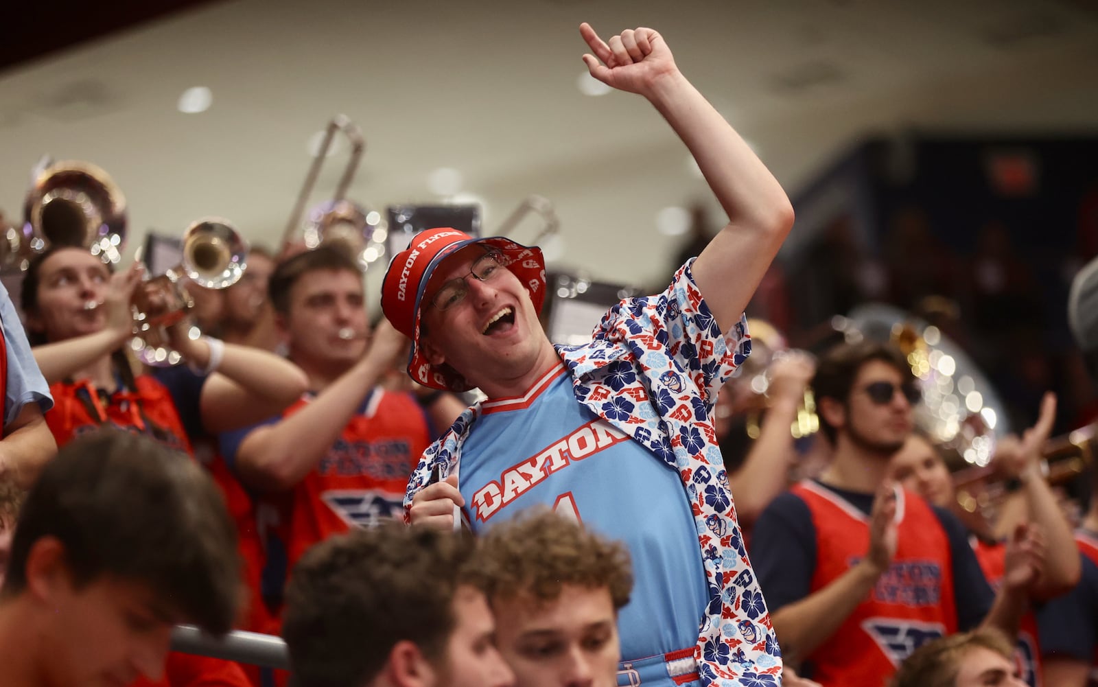 A fan in the Red Scare student section cheers during an exhibition game between Dayton and Penn State on Sunday, Oct. 19, 2025, at UD Arena. "We haven’t won the A-10 tournament since I played," former Flyers standout Keith Waleskowsi said of the program that hasn't won the A-10 tourney title since 2003. "That’s quite the drought. So if we could sucker the A-10 into playing it at Dayton, that might be nice." David Jablonski / Staff