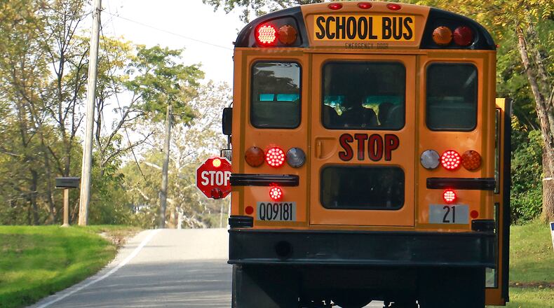 Shawnee school buses are now equiped with new cameras to catch drivers going around the bus when it's letting children on and off. BILL LACKEY/STAFF