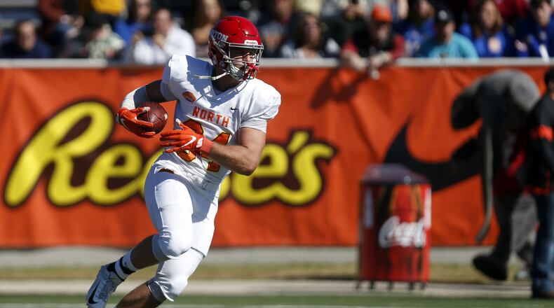 North tight end Adam Trautman of Dayton (84) warms up before the start of the Senior Bowl college football game Saturday, Jan. 25, 2020, in Mobile, Ala. (AP Photo/Butch Dill)