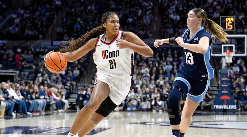 FILE - UConn forward Sarah Strong (21) is guarded by Villanova forward Brynn McCurry (13) in the first half of an NCAA college basketball game, Thursday, Jan. 15, 2026, in Storrs, Conn. (AP Photo/Jessica Hill, File)