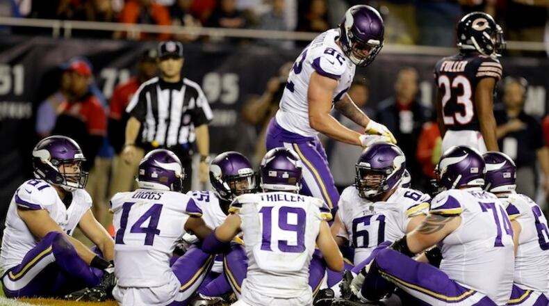Minnesota Vikings tight end Kyle Rudolph (82) celebrates a touchdown with his teammates during the second half of an NFL football game against the Chicago Bears, Monday, Oct. 9, 2017, in Chicago. (AP Photo/Darron Cummings)