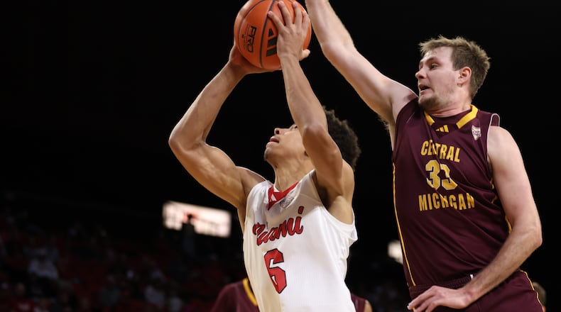Miami’s Justin Kirby goes up for a shot against Central Michigan on Tuesday night at Millett Hall. ELIJAH COOK / CONTRIBUTED