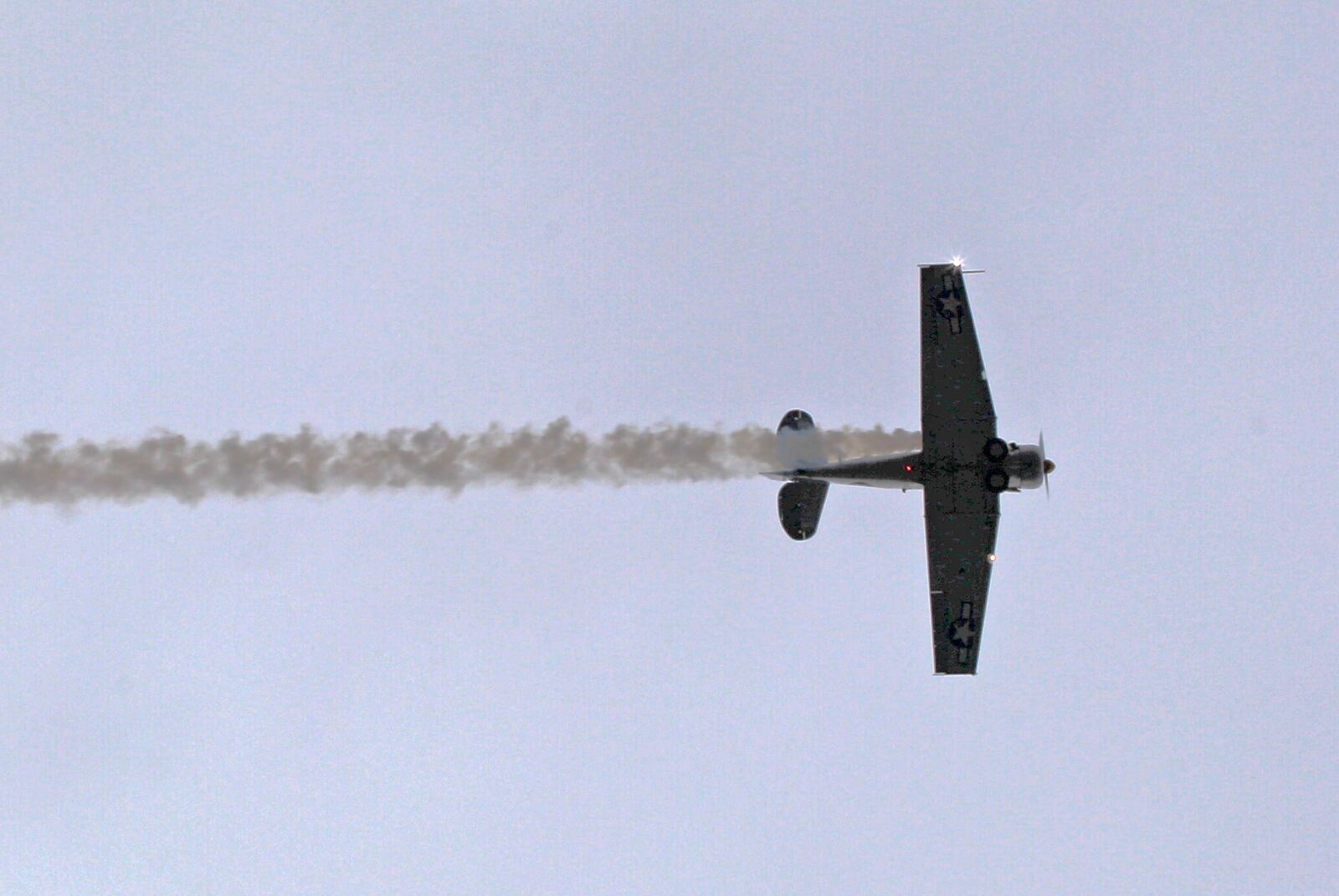 World War II-era T-6 Texan, piloted by Centerville resident and air show performer Bill Leff flew over the Wright Brothers Memorial as a salute to the Wrights and returned for two circles around Wright Memorial Hili on the 114th Anniversary of powered flight.  TY GREENLEES / STAFF