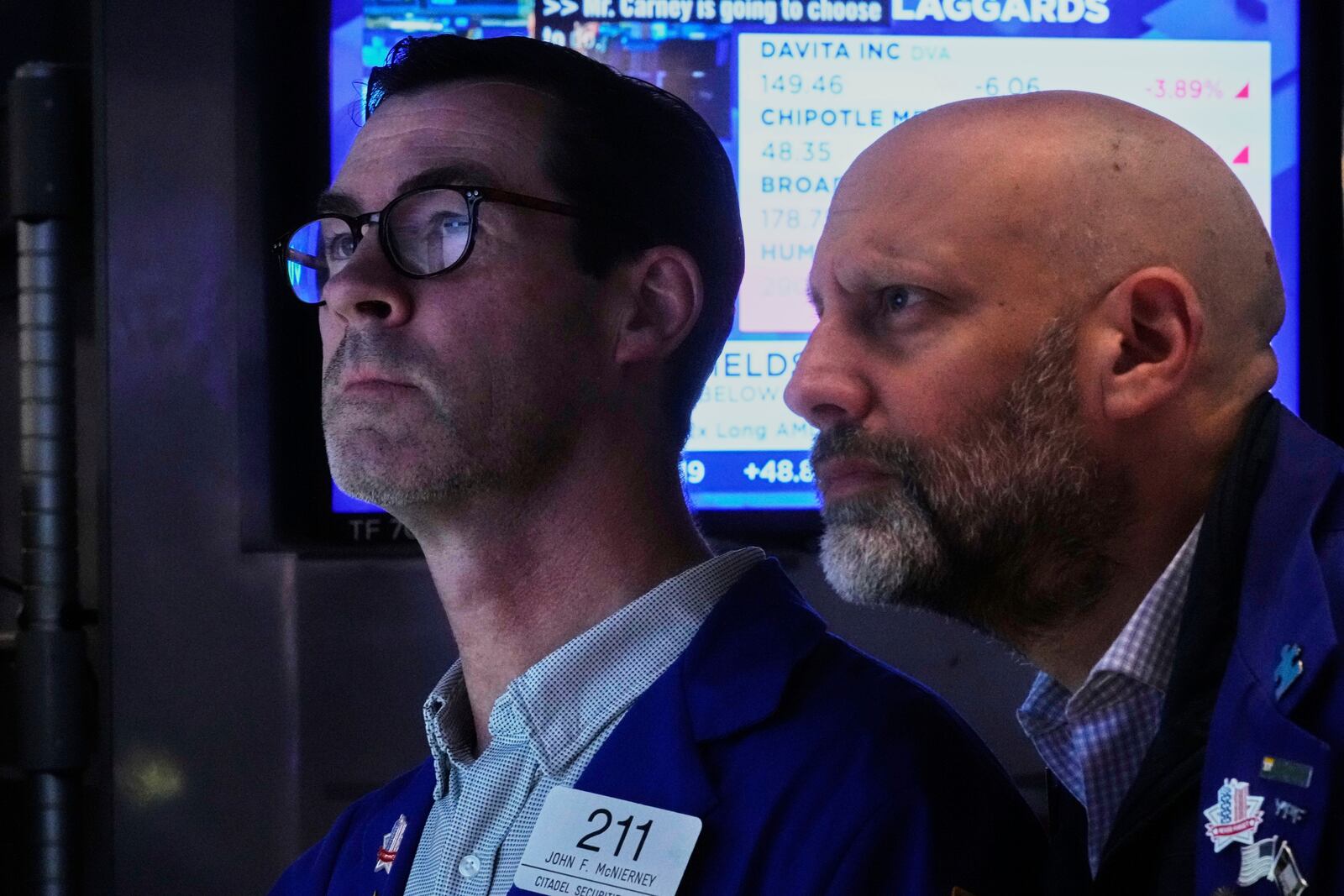 Specialists John McNierney, left, and Meric Greenbaum work on the floor of the New York Stock Exchange, Monday, April 14, 2025. (AP Photo/Richard Drew)
