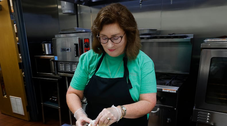 Community Gem, Amy Rollins, is the Miracle Club co-founder and a Goodwill Easter Seals Miami Valley volunteer. MARSHALL GORBY\STAFF