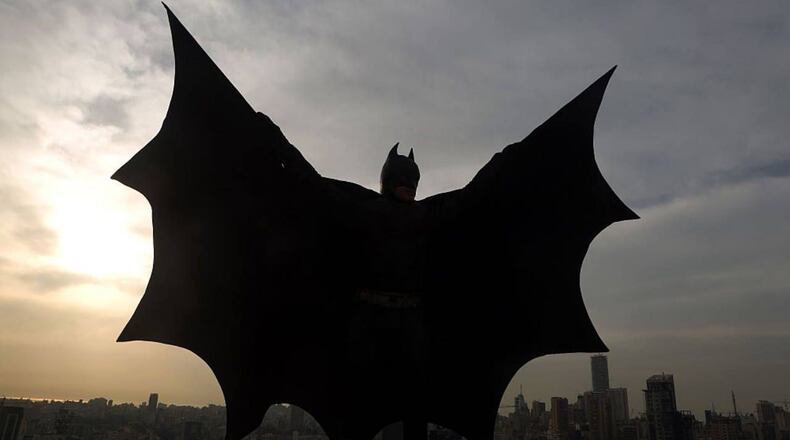 A woman in western New York entertains her grandchildren daily by wearing costumes, including Batman, when she shows up at their door.