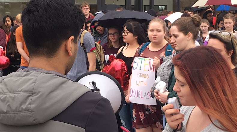 Students at the Dayton Regional STEM School walked out of school Feb. 21 in memory of the students who died during the mass shooting at Marjory Stoneman Douglas High School in Broward, Fla. WILL GARBE / STAFF