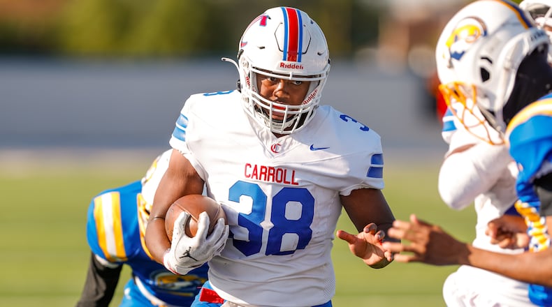 Carroll High School senior Tayshawn Brown runs the ball into the end zone during their game against Ponitz on Thursday, Aug. 22 at Dayton Welcome Stadium. Brown rushed for three TDs as the Patriots won 36-8. Michael Cooper/CONTRIBUTED