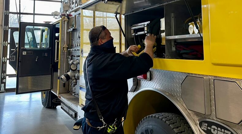 First responder Chris Willoughby of the Vandalia Fire Department conducts a daily check of inventory within one of the station's fire engines. AIMEE HANCOCK/STAFF