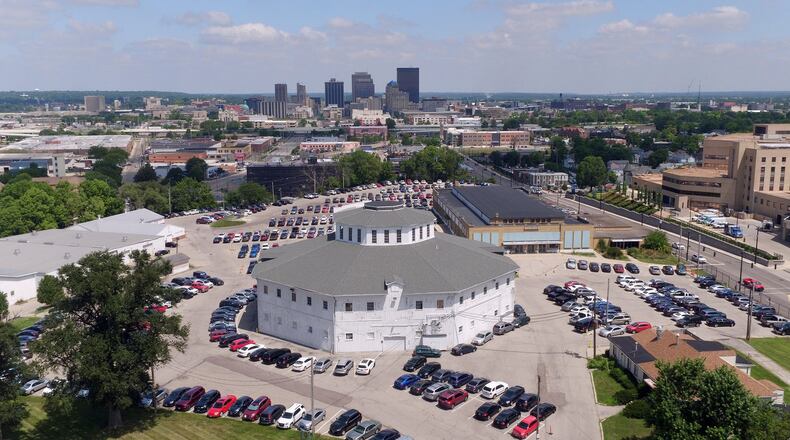 Demolition is expected to begin on about 22 buildings at the Montgomery County Fairgrounds site on South Main Street next week, which will be the first visible signs of work to redevelop the property. After 165 years in Dayton, the Montgomery County Fair moved to a new home in Jefferson Twp. last year. This round barn will remain on the property. TY GREENLEES / STAFF