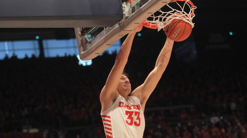 Dayton’s Ryan Mikesell dunks against Massachusetts on Saturday, Jan. 11, 2020, at UD Arena. David Jablonski/Staff