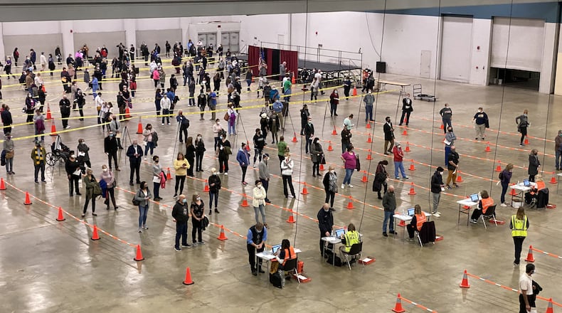 Lines of people awaiting vaccination in 2020 at the Dayton Convention Center. (CONTRIBUTED)