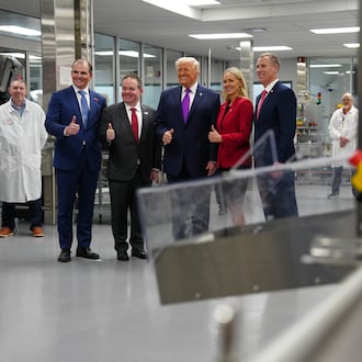 President Donald Trump poses for a photo during a visit to Thermo Fisher Scientific, Wednesday, March 11, 2026, in Cincinnati. (AP Photo/Julia Demaree Nikhinson)