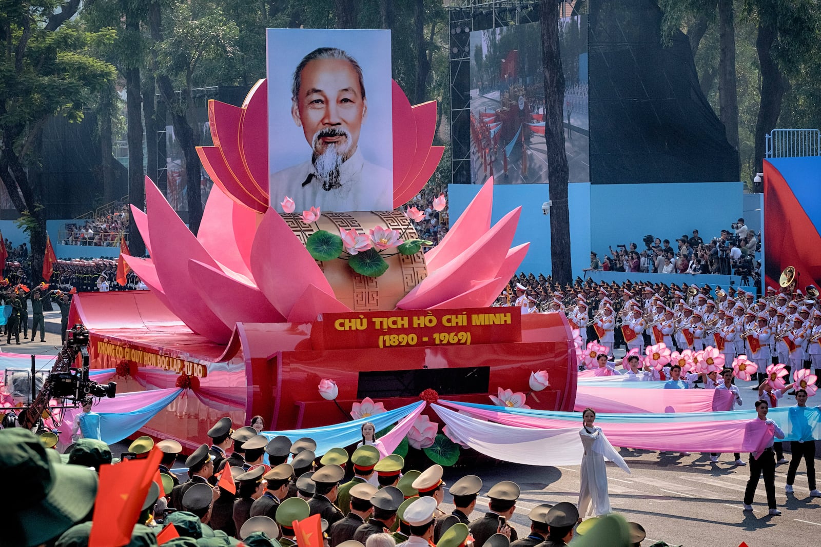 A float carrying a portrait of the late Vietnamese revolutionary leader Ho Chi Minh takes part in a parade during the 50th anniversary celebration of the end of the Vietnam War Wednesday, April 30, 2025, in Ho Chi Minh City, Vietnam. (AP Photo/Richard Vogel)