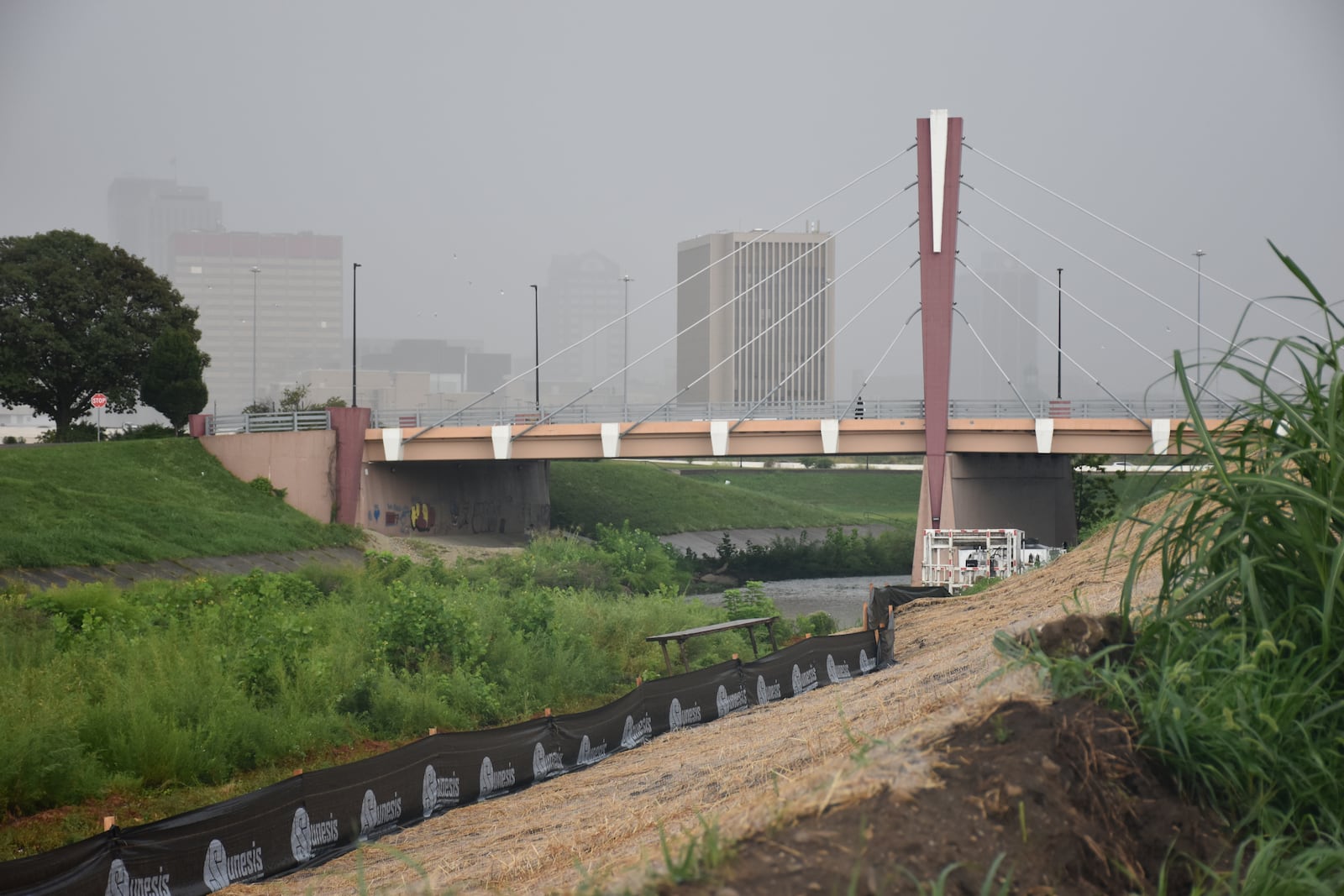 Part of the levees along Wolf Creek in West Dayton will be rebuilt to improve access to the waterway. CORNELIUS FROLIK / STAFF