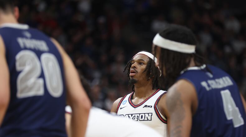 Dayton's DaRon Holmes II prepares to shoot a free throw in the final minutes of the second half against Nevada in the first round of the NCAA tournament on Thursday, March 21, 2024, at the Delta Center in Salt Lake City, Utah. Holmes made the free throw to convert a 3-point play and give Dayton a one-point lead. David Jablonski/Staff