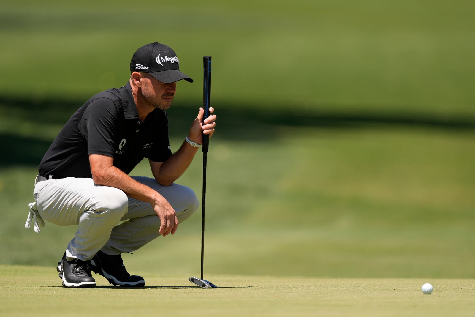 Brian Harman lines up a putt on the second hole during the third round of the RBC Heritage golf tournament, Saturday, April 19, 2025, in Hilton Head Island, S.C. (AP Photo/Mike Stewart)
