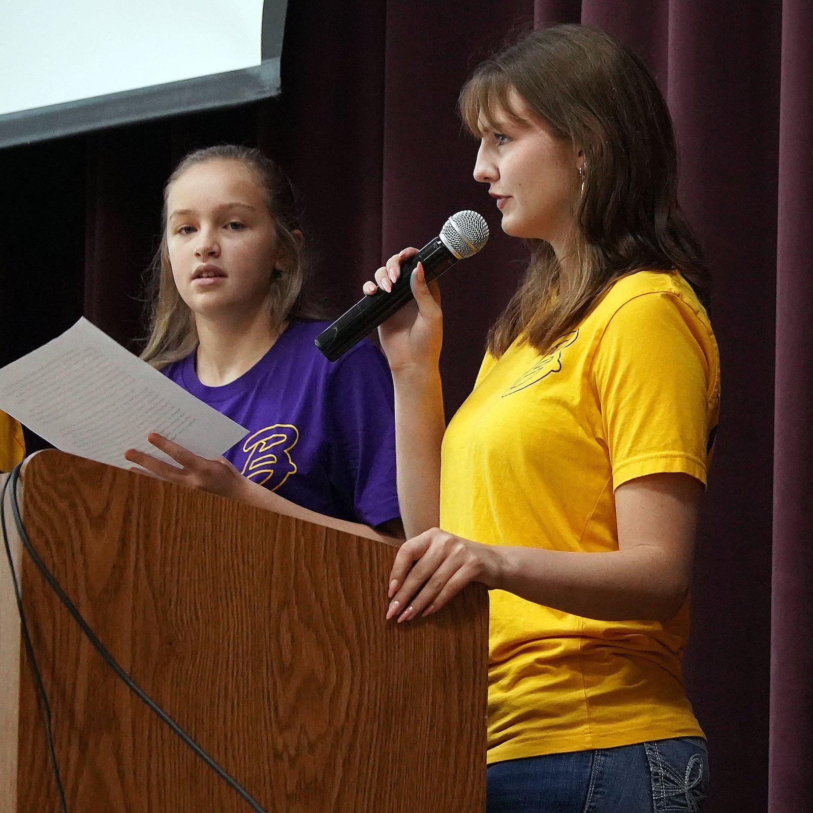 Laney Bottemiller, right, speaks at a Bellbrook High School event. Bottemiller attended the Air Force Flight Academy over the summer and has earned her pilot's license. Courtesy of Bellbrook Schools.