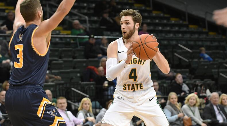 Wright State’s Alan Vest (4) is defended by Cedarville’s Colton Linkous at the Nutter Center on Tuesday, Nov. 27, 2018. Joseph Craven/CONTRIBUTED