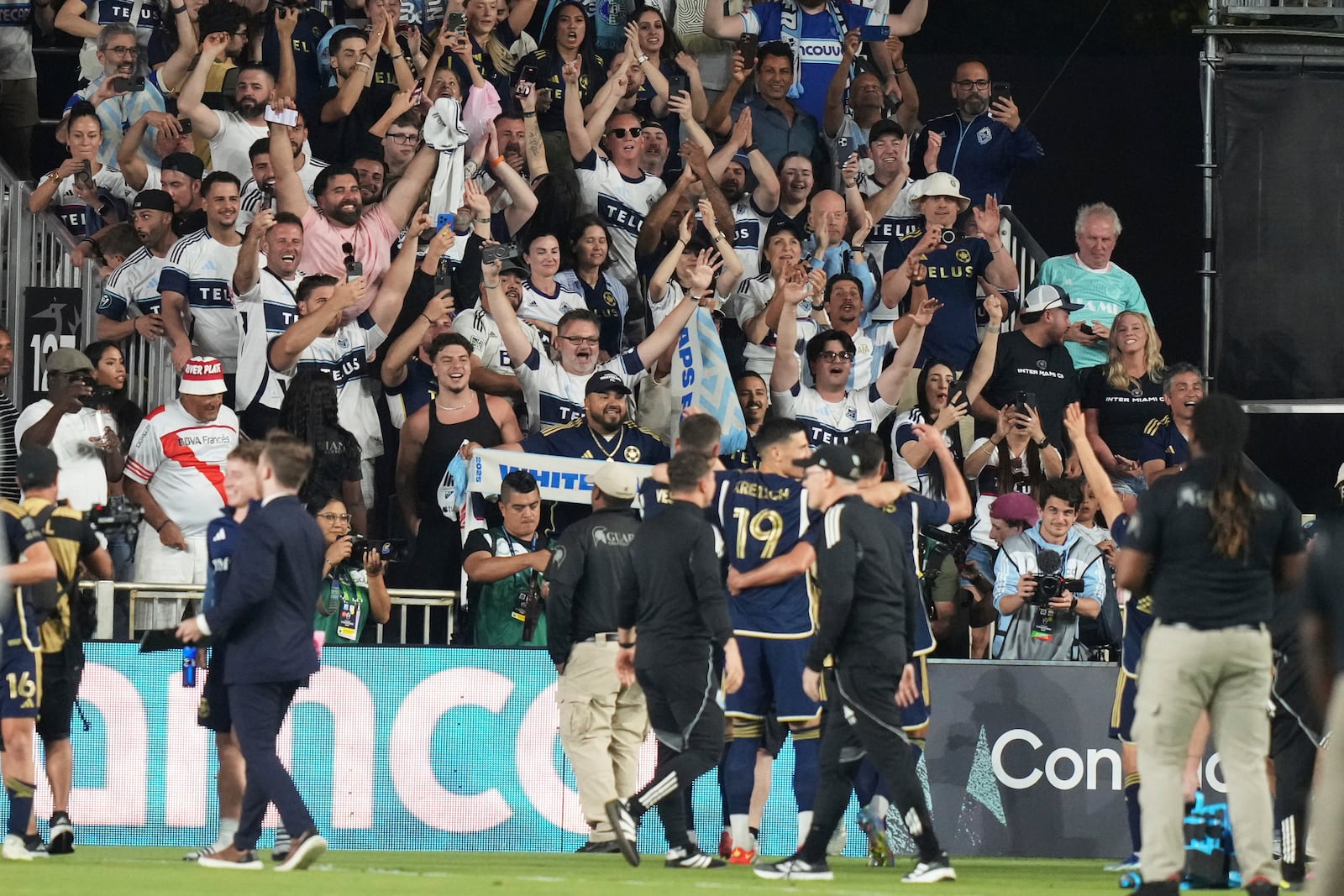 Vancouver Whitecaps fans cheer after a CONCACAF Champions Cup second-leg semifinal soccer match between Inter Miami and the Vancouver Whitecaps, Wednesday, April 30, 2025, in Fort Lauderdale, Fla. (AP Photo/Lynne Sladky)
