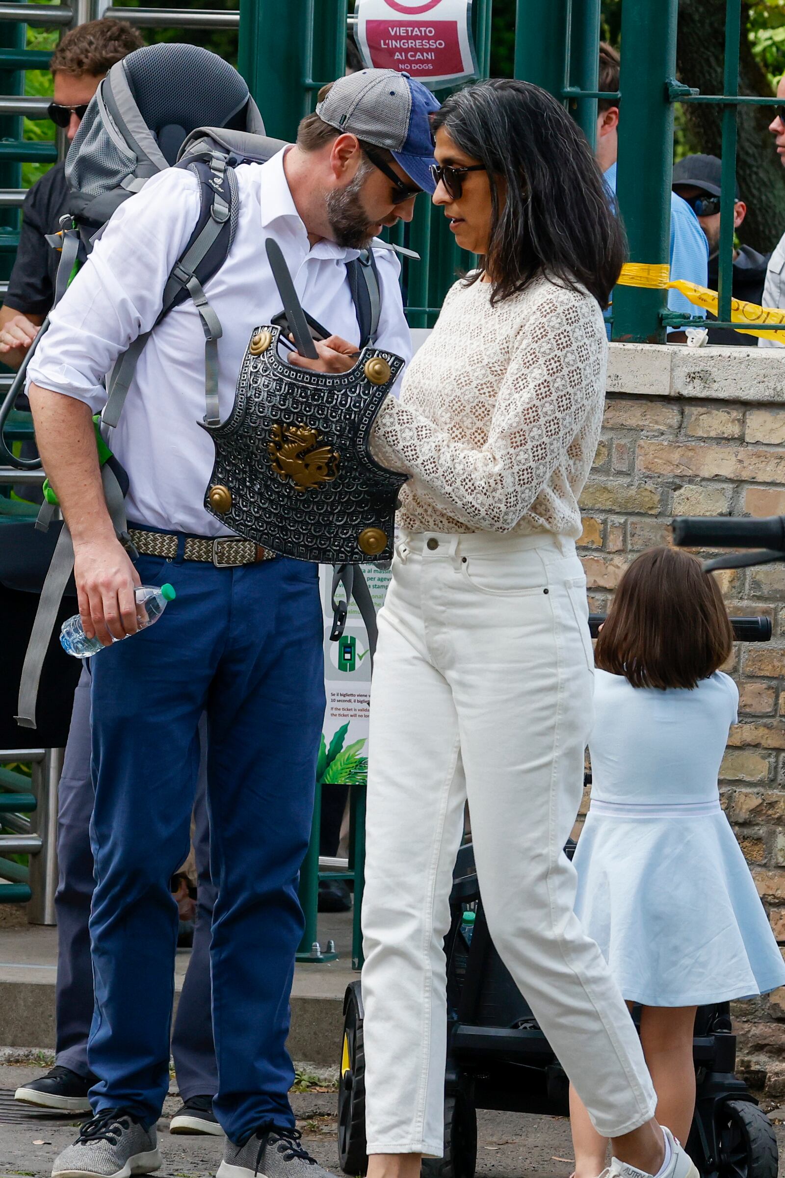 US Vice President J.D. Vance leaves Rome's Botanic Gardens with his wife Usha, center, and their daughter Mirabel, back to camera, Saturday, April 19, 2025. (AP Photo/Riccardo De Luca)