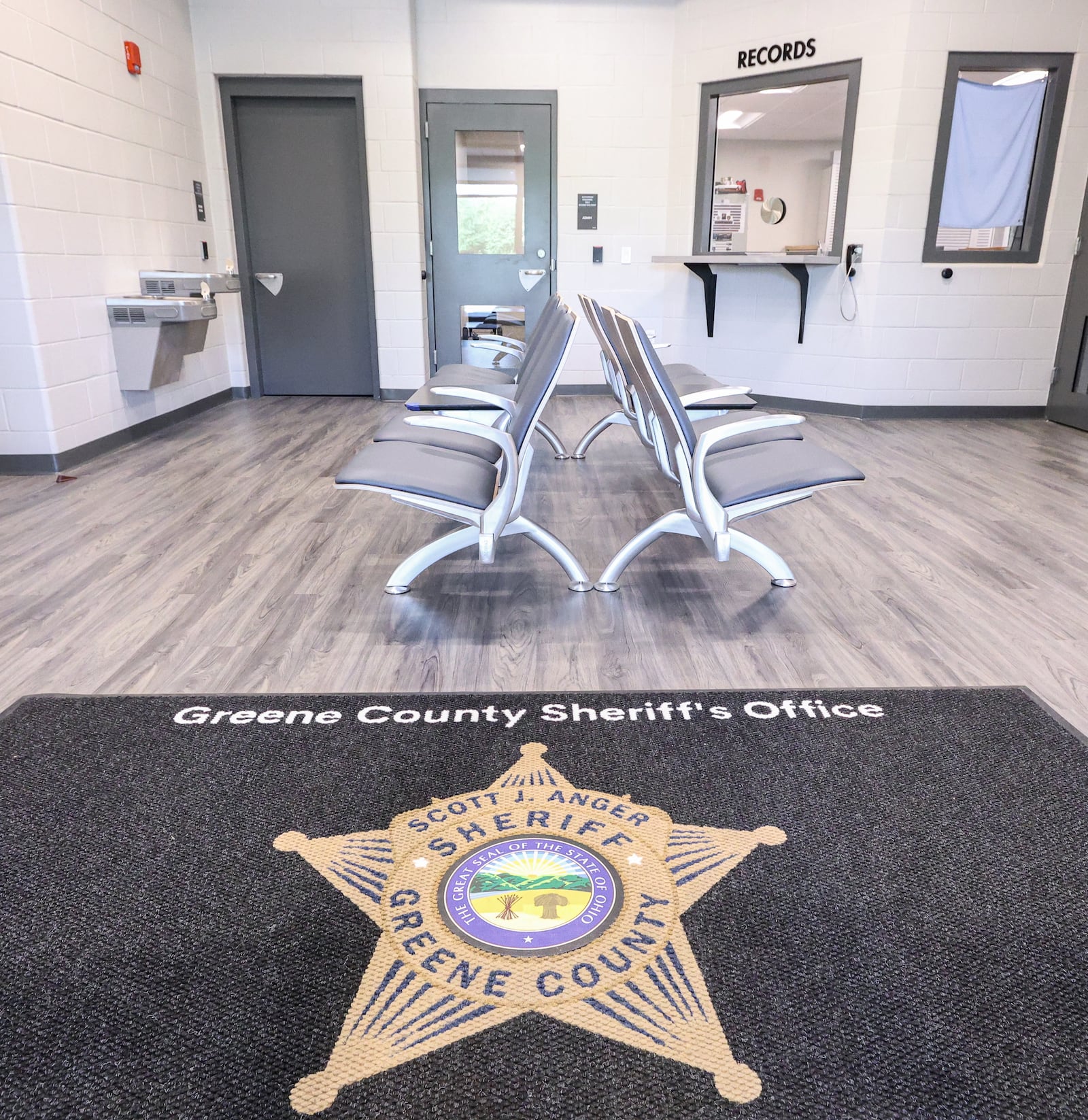 A view of the lobby in the new Greene County Sheriff's Office, which the department moved into in early August. The new facility is located on Greene Way Boulevard,  just off West Main Street in Xenia. Greene County Sheriff Scott Anger said the department's former office in downtown Xenia lacked a proper lobby. BRYANT BILLING / STAFF