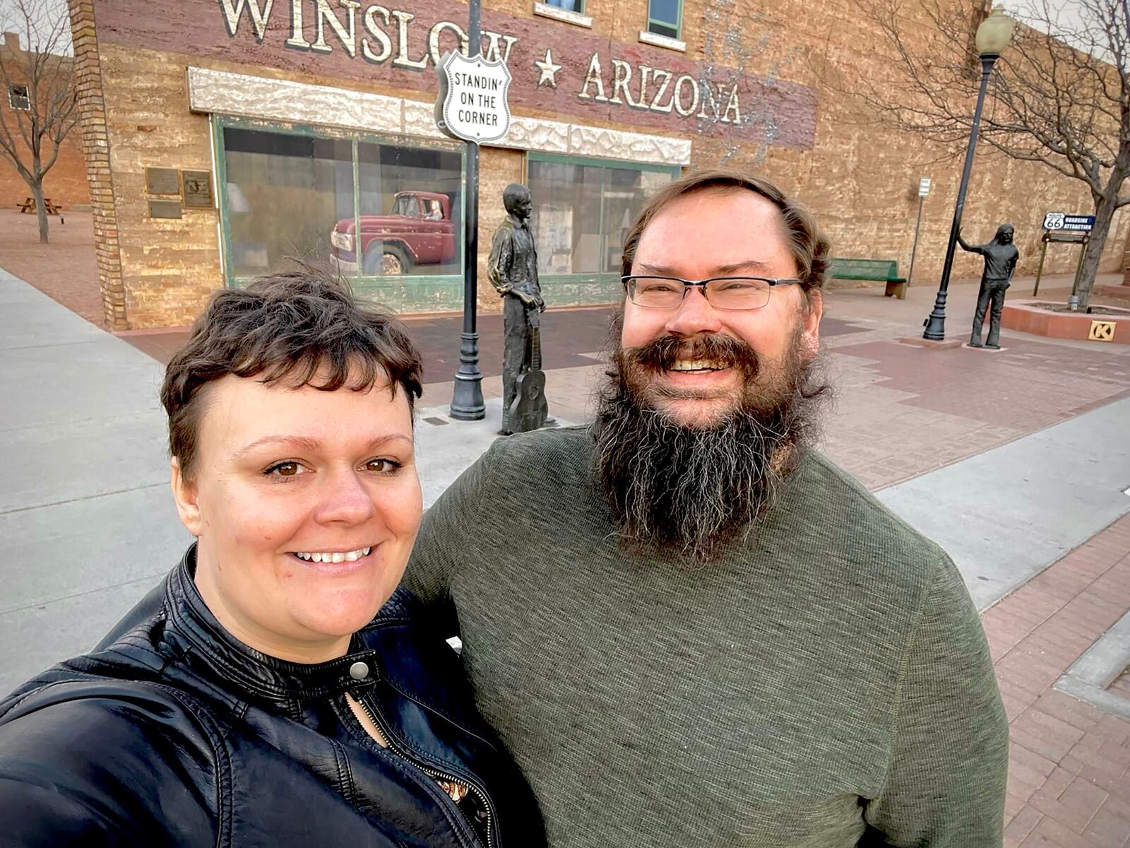 Heather (left) and Bob stand at the place where they got engaged in Winslow, Arizona, during a Route 66 road trip in 2022.