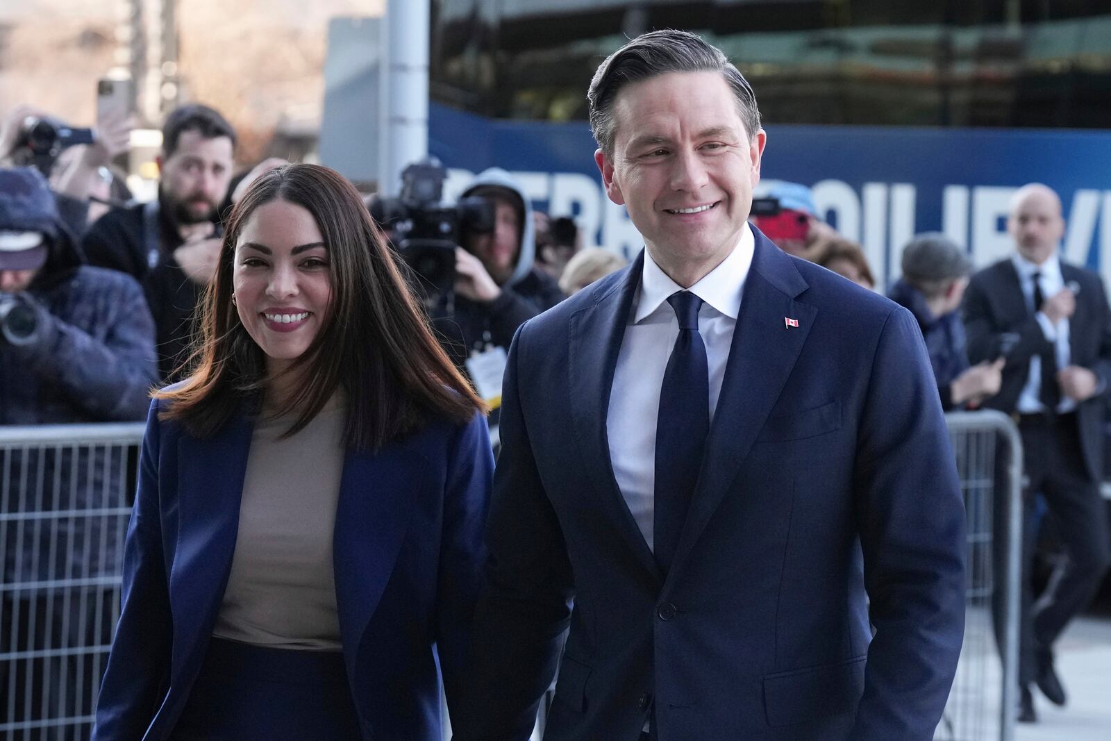 Conservative Leader Pierre Poilievre arrives with his wife Anaida Poilievre, for the English-language federal election debate, in Montreal, Thursday, April 17, 2025. (Chris Young/The Canadian Press via AP)