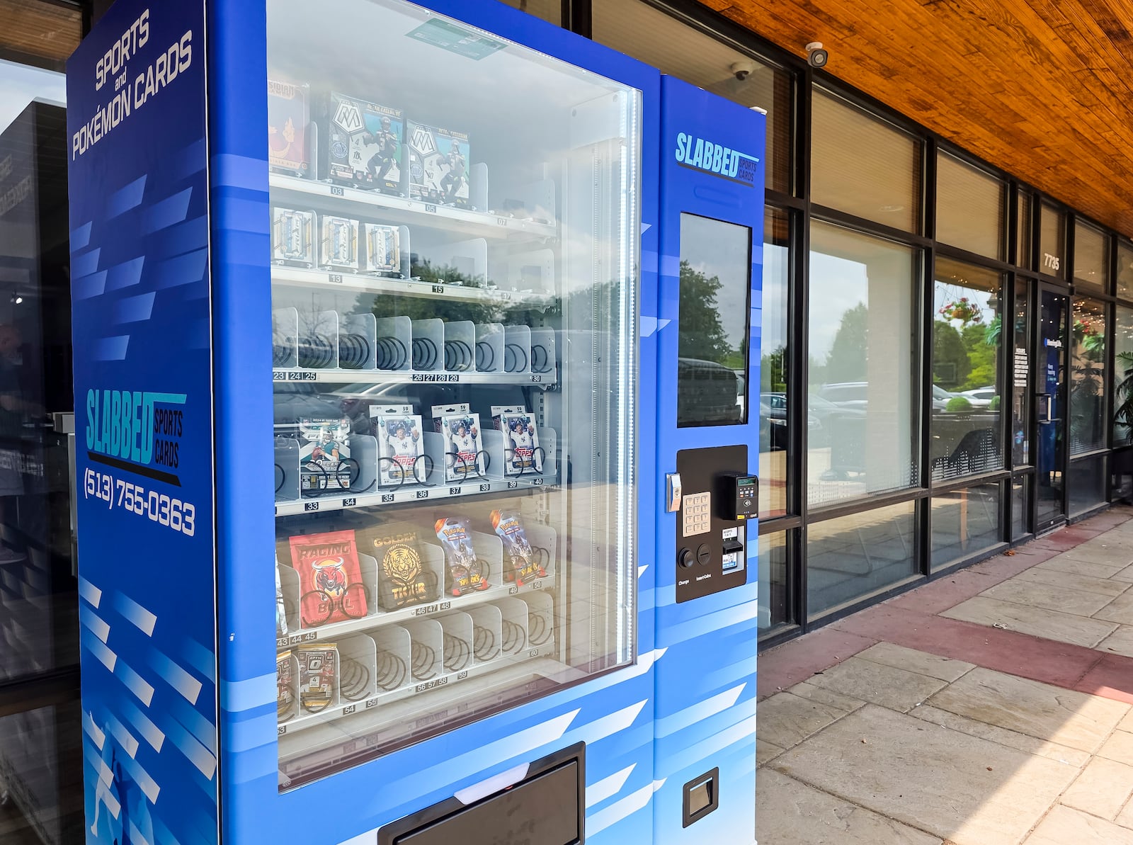 Slabbed Sports Cards on Tylers Place Blvd. in West Chester Township has a sports card vending machine outside to purchase card packs outside of normal operating hours. NICK GRAHAM/STAFF