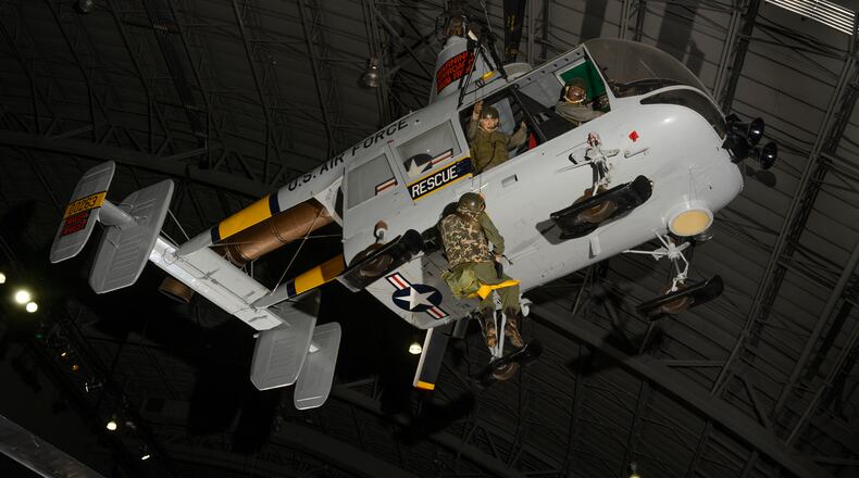 This National Museum of the U.S Air Force exhibit photo shows how an HH-43B Huskie helicopter and its crew would extract personnel during a search and rescue mission. (U.S. Air Force photo by Elizabeth Cueto)