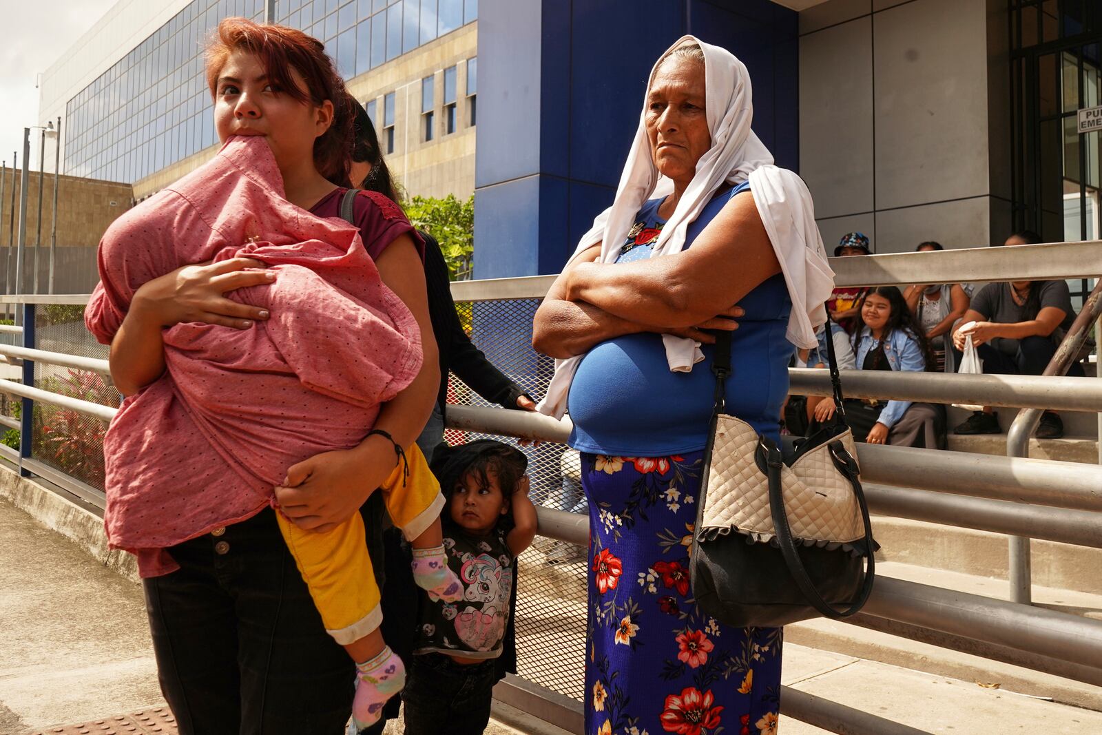 Relatives of Alejandro Henriquez and Jose Angel Perez wait outside the courts during their hearing in Santa Tecla, El Salvador, Friday, May 30, 2025. The National Civil Police arrested them for protesting near the presidnetial residence. (AP Photo/Salvador Melendez)
