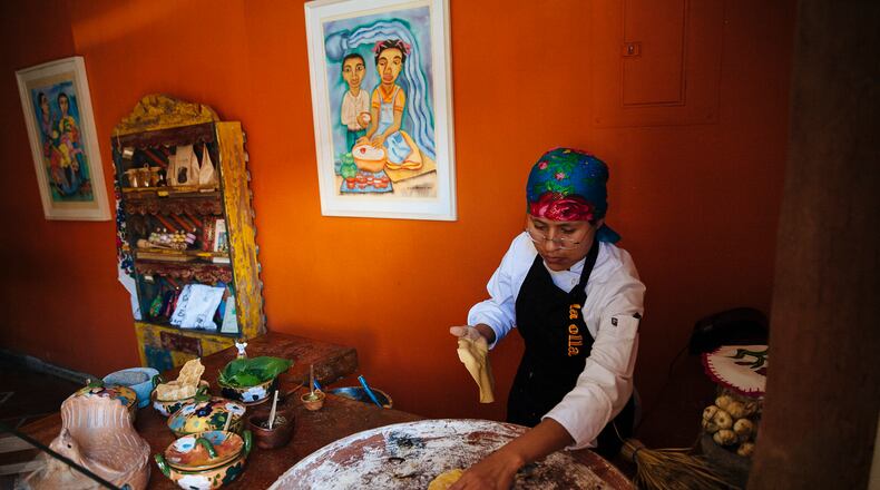 Maria Juana prepares corn tortillas at a restaurant in Oaxaca, Mexico, Feb. 7, 2016. An overseas taste for high-quality Mexican food and its earthy centerpiece, the handmade tortilla, has created a small but growing market for native corn.