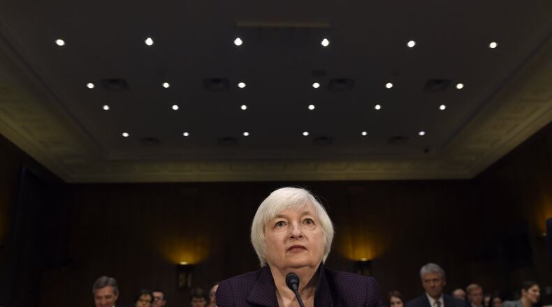 In this Feb. 24 file photo, Federal Reserve Board Chair Janet Yellen prepares to testify on Capitol Hill in Washington, before the Senate Banking Committee. The financial world’s worst-kept secret is that the Federal Reserve is all but sure to raise interest rates from record lows, on Wednesday, Dec. 16, 2015. The uncertainty is what the Fed will say about how much and how fast it expects to raise rates again in coming months. (AP Photo/Susan Walsh, File)