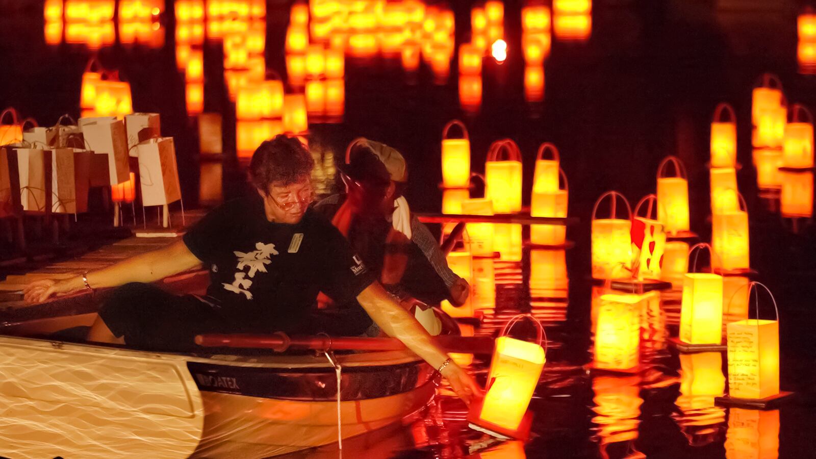 Lanterns on the water at the Morikami Pond during Bon Lantern Festival. (Greg Lovett/The Palm Beach Post)