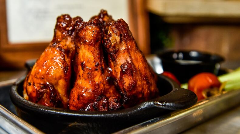 Kings Island held their media day event previewing what to expect this year Wednesday, April 17 in Mason. The Miami River Brewhouse is new for 2019 with dishes crafted by Kings Island's executive chef James Major and features beer from local breweries, appetizers, salads, gourmet sandwiches and premium burgers. The smoked chicken wings are available with sweet bbq or Brew Buffalo Sauce. NICK GRAHAM/STAFF