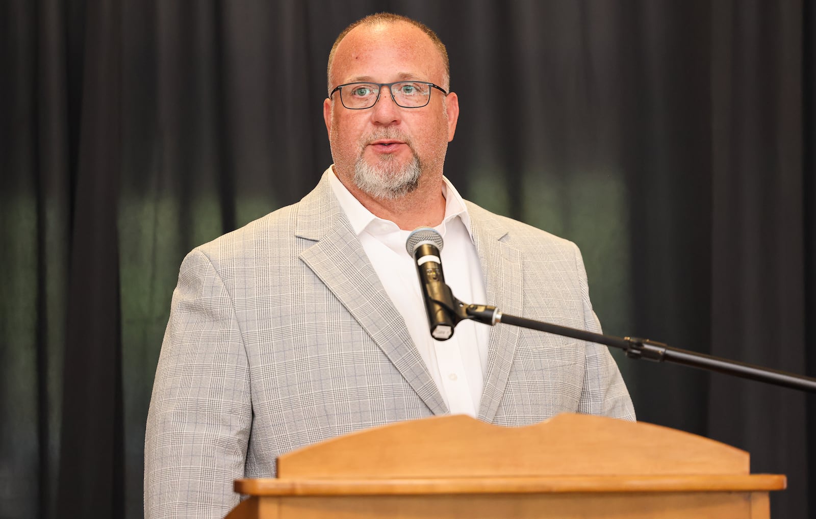 Chris Cassano speaks during the 2025 Dayton Region Walk of Fame inductee luncheon, which was held Tuesday, Sept. 24 at Sinclair Community College. Cassano is the grandson of Cassano's Pizza founder Vic Cassano Sr., who was inducted along with The Original Lakeside, Rob Lowe, the Levin Family and Jenell Ross. BRYANT BILLING / STAFF